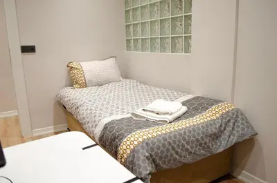 a small room with a bed and a pillow at My Glamorous Stay at Kadikoy Istanbul Türkiye in Istanbul