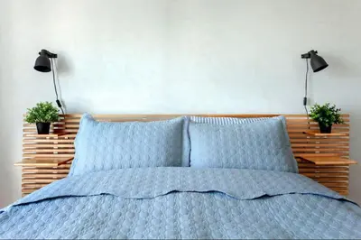 a bedroom with a bed with two plants on it at Historic Elegance with a Bosphorus Gaze in Istanbul