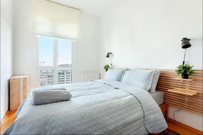 a white bedroom with a large bed and a window at Historic Elegance with a Bosphorus Gaze in Istanbul