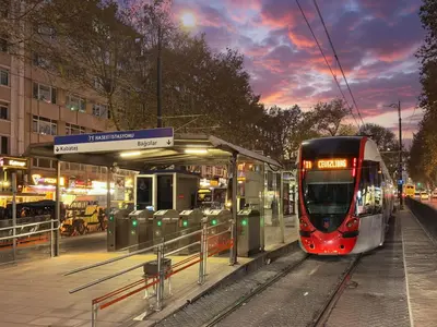 a red and white train at a train station at QUİ Hotel&SPA in Istanbul