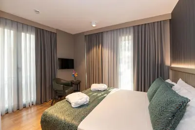 a hotel room with a bed with towels on it at QUİ Hotel&SPA in Istanbul