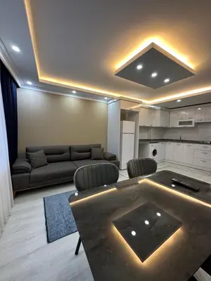 a living room with a couch and a table at Loft House Studio in Arnavutköy