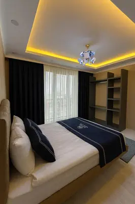 a bedroom with a large bed in a room at Loft House Studio in Arnavutköy