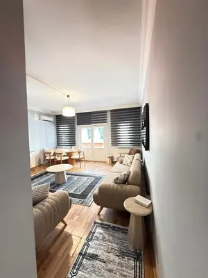 a living room with couches and a dining room at Residence 4 in Istanbul
