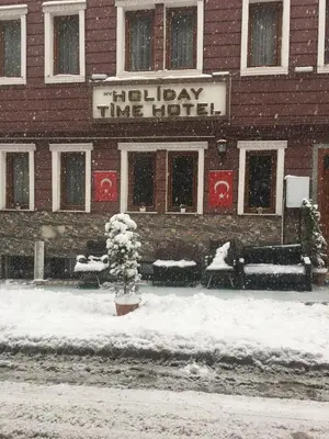 a hotel in the snow in front of a building at My Holiday Time Hotel in Istanbul