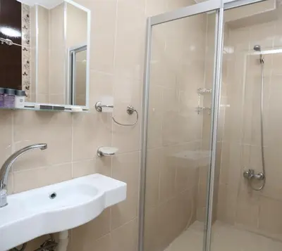 a bathroom with a sink and a shower at My Holiday Time Hotel in Istanbul
