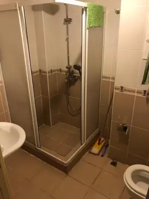 a bathroom with a shower with a sink and a toilet at Bahar 5 in Istanbul