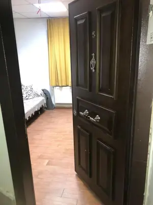 a black door in a room with a bed at Bahar 5 in Istanbul
