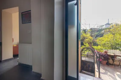 an open door to a balcony with a view at Calm & Charming 1BR with Shared Lush Garden Access in Istanbul