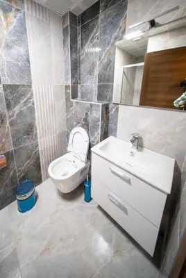 a bathroom with a toilet and a sink at Zirvesta Otel in Istanbul