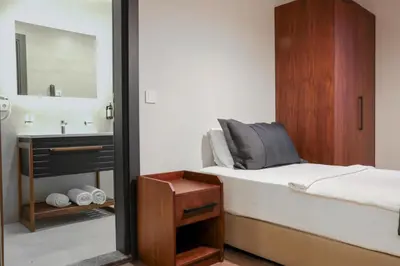 a bedroom with a bed and a sink and a mirror at Best Western Plus Sapanca in Sapanca