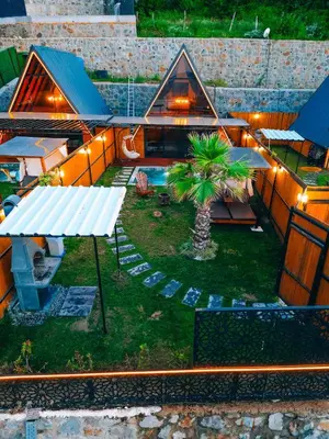 an overhead view of a patio with a palm tree and lights at Bungorise Bungalov in Sapanca