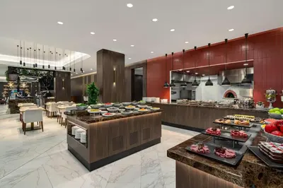 a restaurant with a buffet line with food on display at Ramada by Wyndham Arnavutkoy in Istanbul