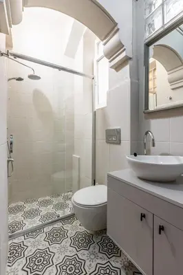 a white bathroom with a sink and a toilet at Ganbaru Tours - Flats in Galata 2 in Istanbul
