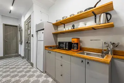 a kitchen with white cabinets and a sink at Ganbaru Tours - Flats in Galata 2 in Istanbul