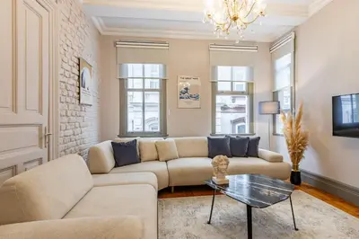 a living room with a couch and a table at Ganbaru Tours - Flats in Galata 2 in Istanbul
