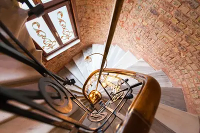 an overhead view of a staircase with a chandelier at Hotel Pera Parma in Istanbul