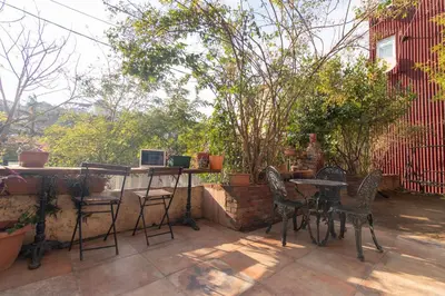 a patio with chairs and a table with a view at Leafy Views & Light Filled Comfort in Kuzguncuk in Istanbul