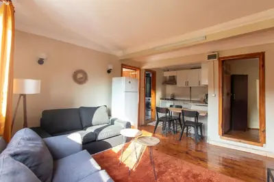 a living room with a couch and a table at Leafy Views & Light Filled Comfort in Kuzguncuk in Istanbul