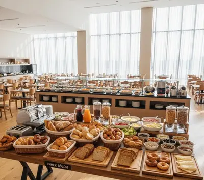 a table filled with lots of different types of food at Yeni Yıl Apart in Bandırma