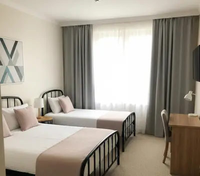 a hotel room with two beds and a window at Yeni Yıl Apart in Bandırma