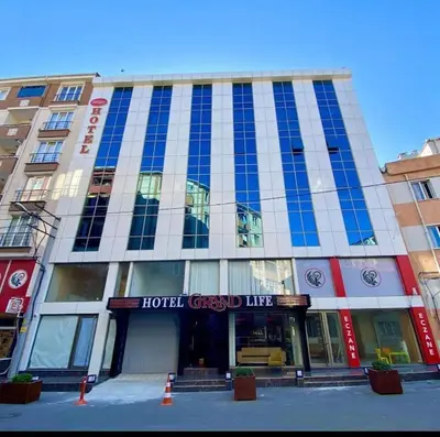 a large building with a hotel grand line at grand life hotel in Corlu