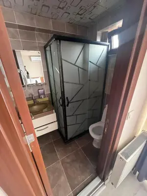 a bathroom with a shower and a toilet and a sink at grand life hotel in Corlu