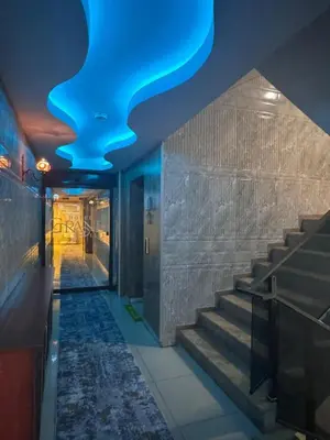 a staircase with a blue ceiling in a building at grand life hotel in Corlu