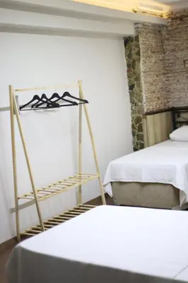 two beds in a room with two beds sidx sidx sidx at Detached villa with a heated pool and garden in Sapanca