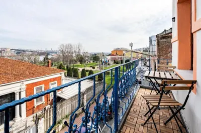 a balcony with chairs and a view of a city at Timeless House Overlooking the Golden Horn with Sea - Nilorayn in Istanbul