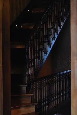 a staircase in a home with wooden railings at The Yard Hotel in Istanbul