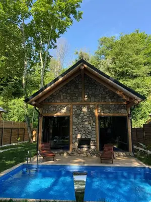 a pavilion with a pool in front of a house at HARA Bıçkıdere in Akyazı