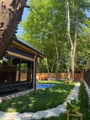 a backyard with a pool and a house at HARA Bıçkıdere in Akyazı