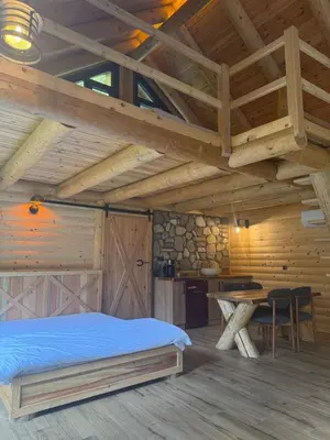 a bedroom with a bed and a wooden ceiling at HARA Bıçkıdere in Akyazı