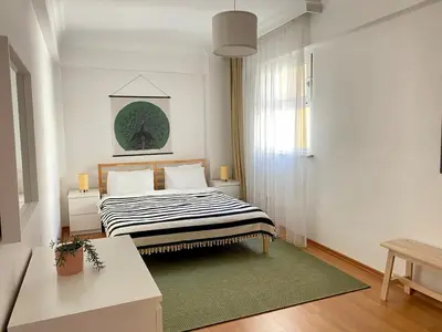 a bedroom with a bed with a green rug at Central Location 3 Bedroom Flat - No6 in Istanbul