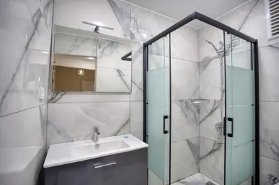 a bathroom with a sink and a shower at Işıl Otel Old City in Istanbul