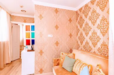 a living room with a couch and a wall at Walnut Shell Hotel in Istanbul
