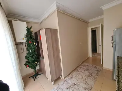 a christmas tree in the corner of a kitchen at Specius Flat Near Yeditepe Univ in Istanbul