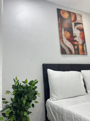 a bedroom with a bed and a potted plant at Taksim Dolunay Suites in Istanbul