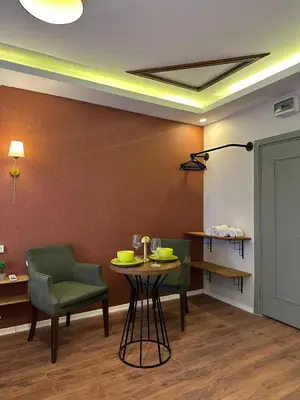a dining room with a table and two chairs at PeraHomes DE in Istanbul