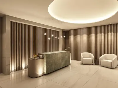 a lobby with a reception desk and two chairs at Rayelin Hotel Taksim in Istanbul