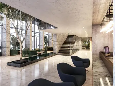 a lobby with chairs and a staircase in a building at Rayelin Hotel Taksim in Istanbul