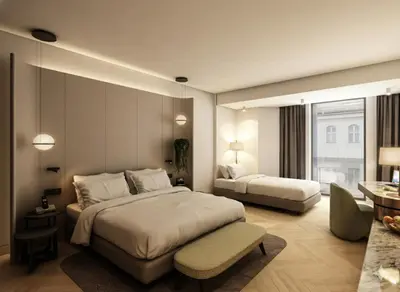 a hotel room with two beds and a table at Rayelin Hotel Taksim in Istanbul