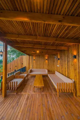 a large wooden room with benches and a wooden floor at Localita Sapanca in Sapanca