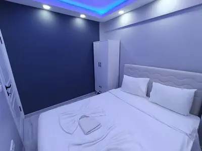 a bedroom with a large white bed with white pillows at BlueRoyal Home Sultanahmet in Istanbul