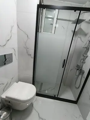 a bathroom with a shower and a toilet at BlueRoyal Home Sultanahmet in Istanbul