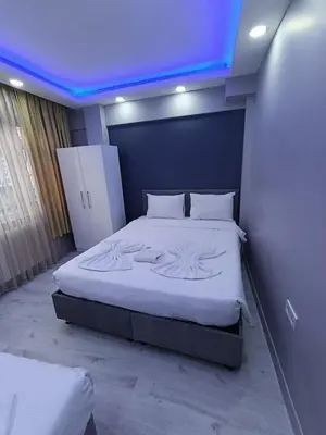 a bedroom with a large bed with a blue ceiling at BlueRoyal Home Sultanahmet in Istanbul