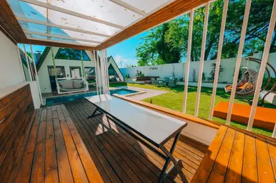 a screened in porch with a bench on a wooden deck at 777Sapanca Bungalov Konaklama in Sapanca