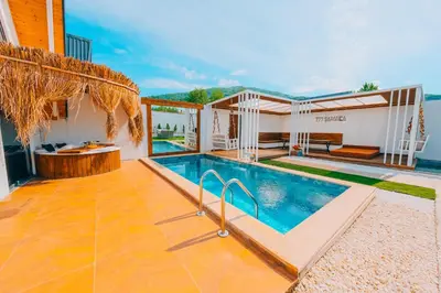 a house with a swimming pool and a patio at 777Sapanca Bungalov Konaklama in Sapanca