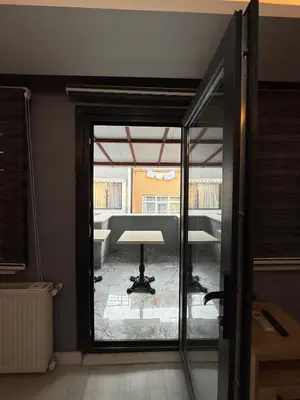 a view of a room with a table and a window at Atay Apart in Istanbul